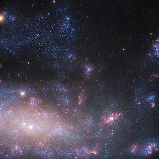 Hubble Gazes at the Home of an Enormous Black Hole