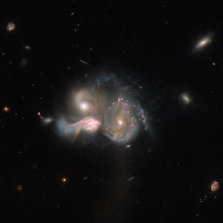 Hubble Views a Merging Galactic Trio