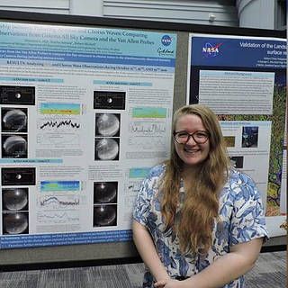 Photo of Shannon Hill in front of her science poster