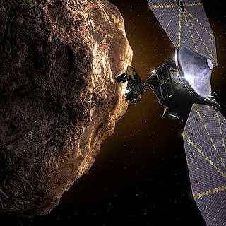 Illustration of Lucy spacecraft near an asteroid